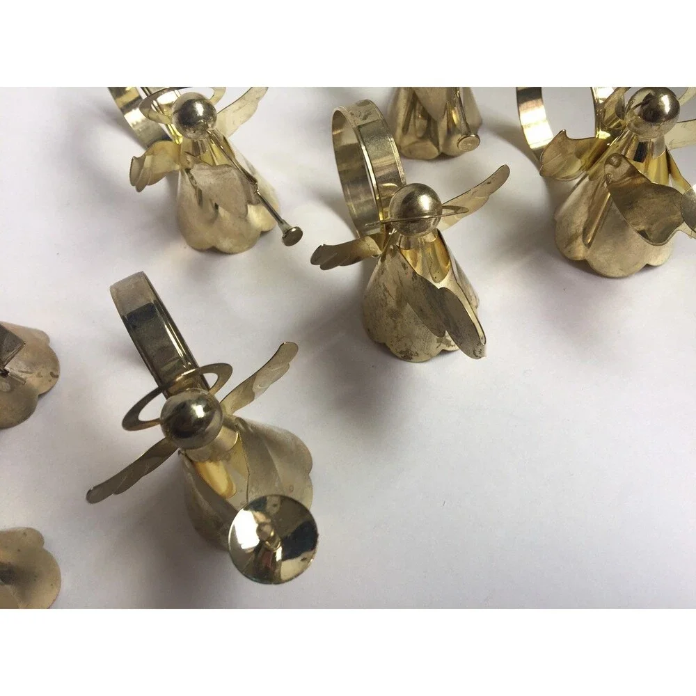 Set of 8 vintage napkin rings trumpet singing drums and candle